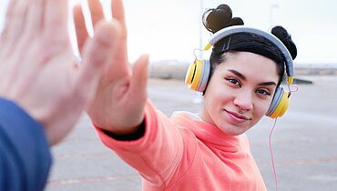 young woman giving a high five
